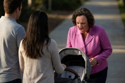 California Democrat Katie Porter looking down at a baby stroller and yelling.