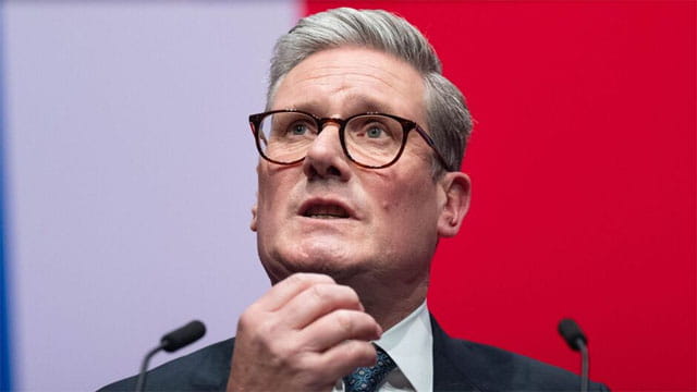 UK Labour Party Prime Minister Keir Starmer rubbing his chin.