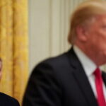 Lindsey Graham, standing behind Donald Trump on stage during Iran peace deal.