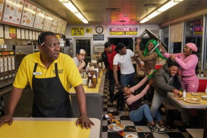Spirit Airlines black man employee at a Waffle House watching a fight between multiple black men and women.