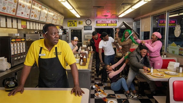 Spirit Airlines black man employee at a Waffle House watching a fight between multiple black men and women.