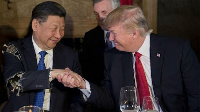 President Trump and President Xi shaking hands on stage in China Summit.