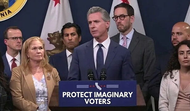 California Democrats and Gavin Newsom on stage giving a speech.