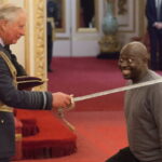 UK's King Charles knighting the Sudanese immigrant Belfast attacker.