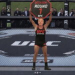 Lindsey Graham wearing a Octagon Girl uniform holding up a sign at Trump's UFC Freedom Event.