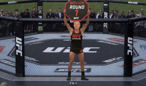 Lindsey Graham wearing a Octagon Girl uniform holding up a sign at Trump's UFC Freedom Event.