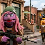 Sesame Street trans Muppet holding a gun on a Pride Month episode.