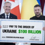 Canada Prime Minister Mark Carney and Ukraine President Zelensky holding a large check for the Canadian wildfires.