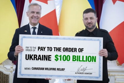 Canada Prime Minister Mark Carney and Ukraine President Zelensky holding a large check for the Canadian wildfires.