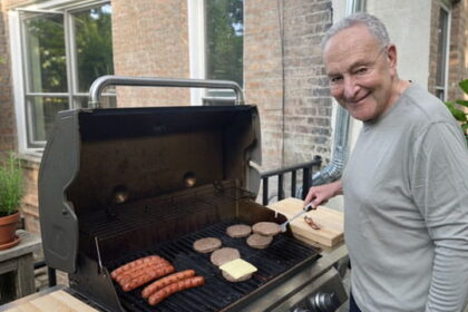 Democrat Chuck Schumer barbequing a raw hamburger on Father's Day.