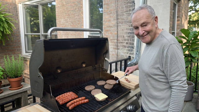 Democrat Chuck Schumer barbequing a raw hamburger on Father's Day.