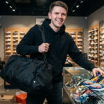 Texas Democrat James Talarico wearing black clothes looting a shoe store.