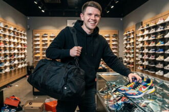 Texas Democrat James Talarico wearing black clothes looting a shoe store.