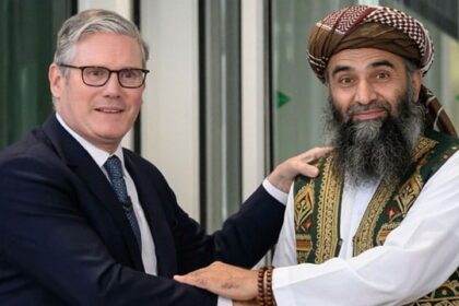UK Prime Minister Keir Starmer shaking hands with Pakistani male Muslim grooming gang member.