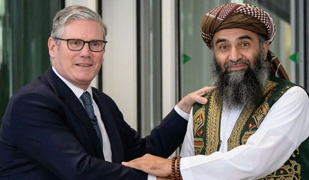 UK Prime Minister Keir Starmer shaking hands with Pakistani male Muslim grooming gang member.