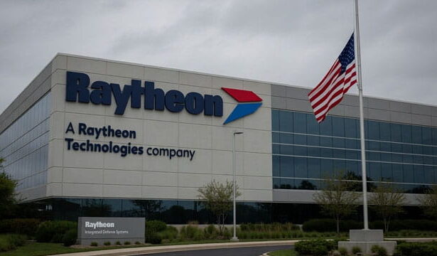 Raytheon building with an American flag at half-mast in memory of deceased Lindsey Graham.