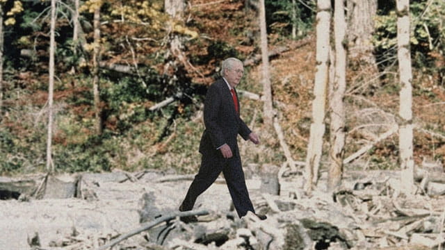 Mitch McConnell walking in the woods in a parody Bigfoot sighting.