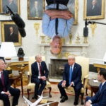 RFK Jr. sleeping upside down from the Oval Office ceiling like a bat as President Trump and Cabinet members down below hold a meeting.