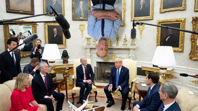 RFK Jr. sleeping upside down from the Oval Office ceiling like a bat as President Trump and Cabinet members down below hold a meeting.