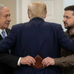 Benjamin Netanyahu and Volodymyr Zelensky hugging President Donald Trump inside of White House.