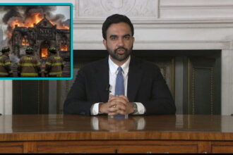 NYC Mayor Zohran Mamdani giving a speech at a desk regaring church fires.