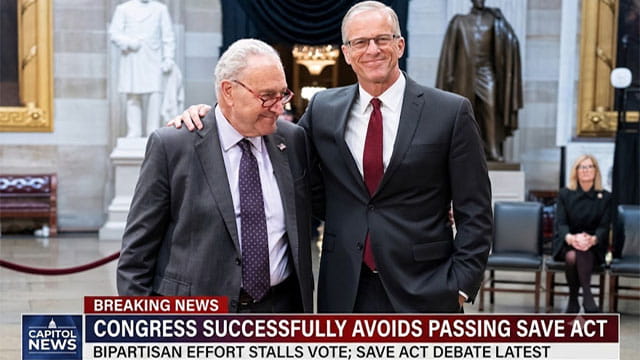 Congress members John Thune and Chuck Schumer hugging one another in Capitol Hill.