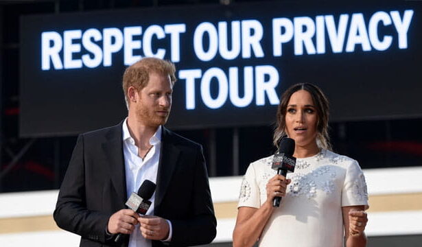 Prince Harry and Meghan Markle Giving a speech on stage.