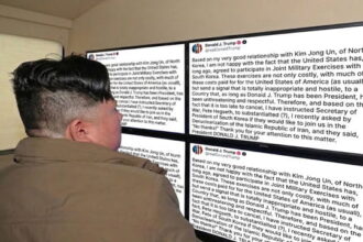 North Korea Leader Kim Jong Un looking at a computer screen with Trump's Truth Social post.