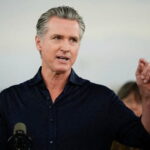 Gavin Newsom giving a press conference on El Niño .