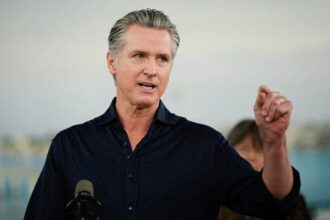 Gavin Newsom giving a press conference on El Niño .