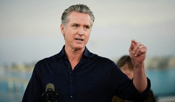 Gavin Newsom giving a press conference on El Niño .