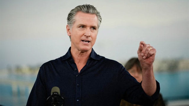 Gavin Newsom giving a press conference on El Niño .