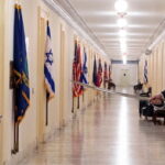 Israeli Prime Minister Benjamin Netanyahu standing outside Congress members offices.
