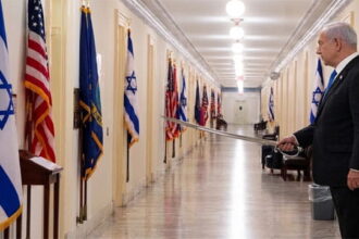 Israeli Prime Minister Benjamin Netanyahu standing outside Congress members offices.