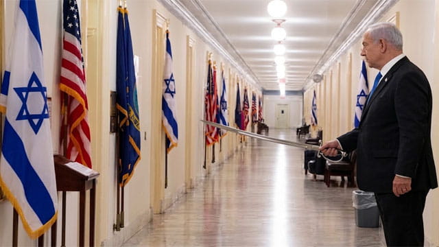 Israeli Prime Minister Benjamin Netanyahu standing outside Congress members offices.
