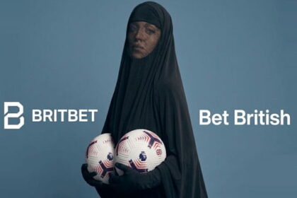 Sydney Sweeney wearing a black burka posing for a UK sports betting app ad.