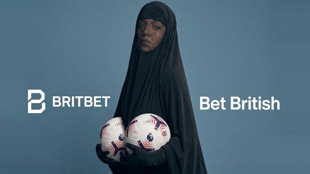 Sydney Sweeney wearing a black burka posing for a UK sports betting app ad.