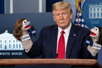President Trump with a sock puppet on each hand inside White House.