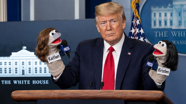 President Trump with a sock puppet on each hand inside White House.