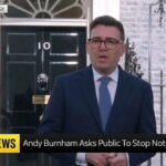 UK Prime Minister Andy Burnham giving a speech in front of prime minister's office on migrants.