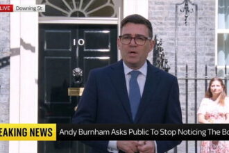 UK Prime Minister Andy Burnham giving a speech in front of prime minister's office on migrants.