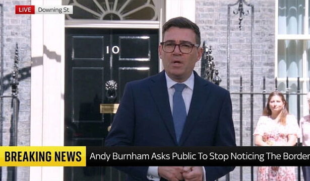 UK Prime Minister Andy Burnham giving a speech in front of prime minister's office on migrants.