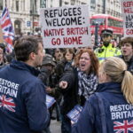 White British Restore Britain men and women being protested by Anti-Racism activists in the UK.