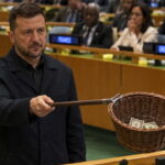 Ukraine President Zelensky passing around a collection basket at the United Nations.