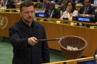 Ukraine President Zelensky passing around a collection basket at the United Nations.