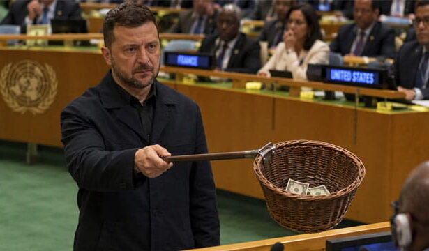 Ukraine President Zelensky passing around a collection basket at the United Nations.
