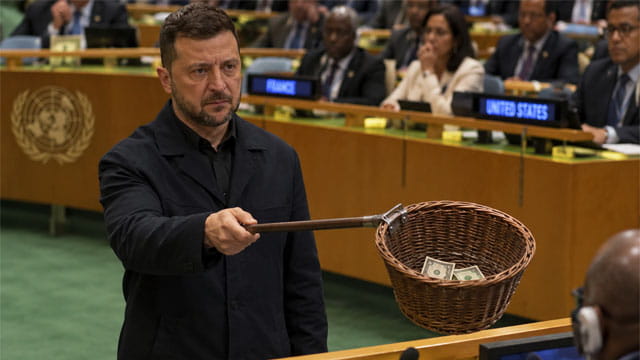 Ukraine President Zelensky passing around a collection basket at the United Nations.