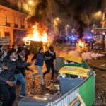 French students and African and Arab migrants rioting and burning buildings during the French student protests in France.