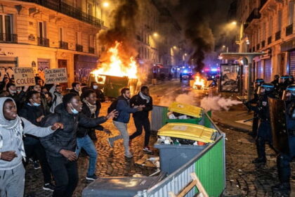 French students and African and Arab migrants rioting and burning buildings during the French student protests in France.