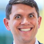 Male Democrat Texas politician James Talarico wearing a suit and smiling.